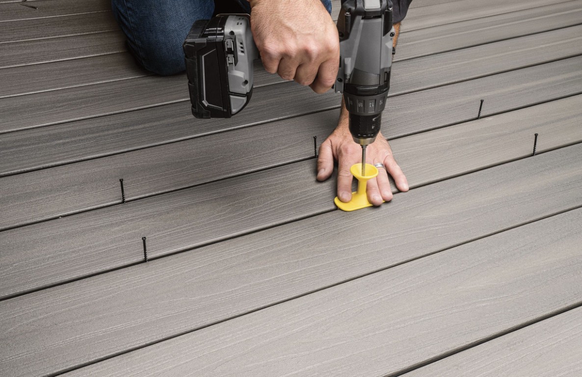 Professional deck installation comparing materials